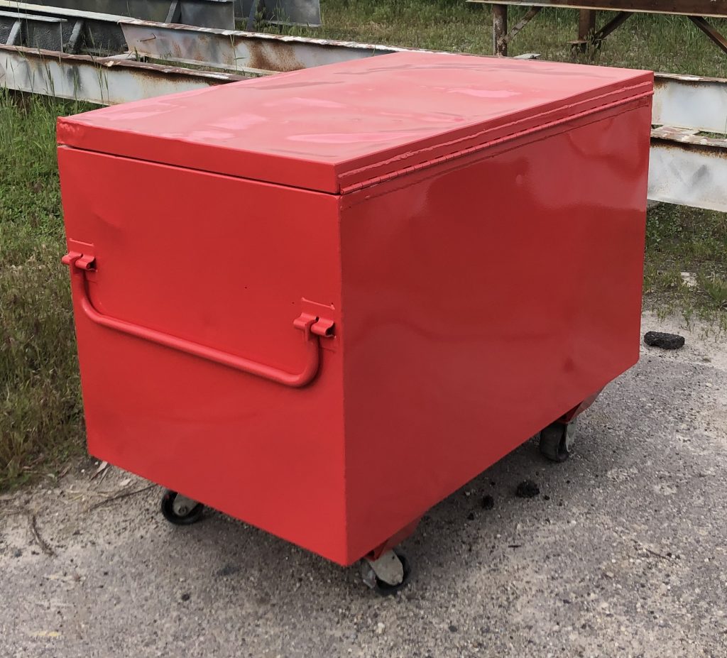 Red painted box structure on wheels